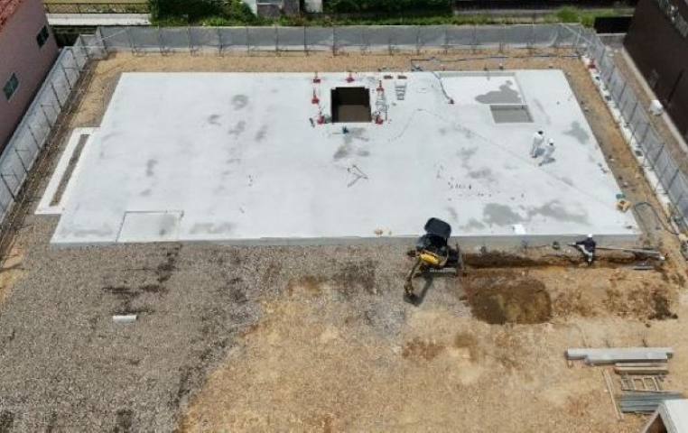 岐阜県岐阜市で建築中の木造老人ホームのEVピット防水工事の上空からの様子